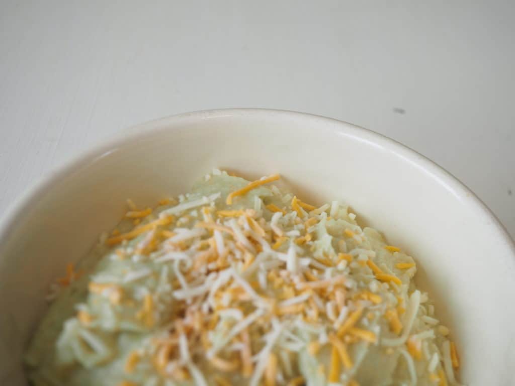 cheesy mashed cauliflower in bowl