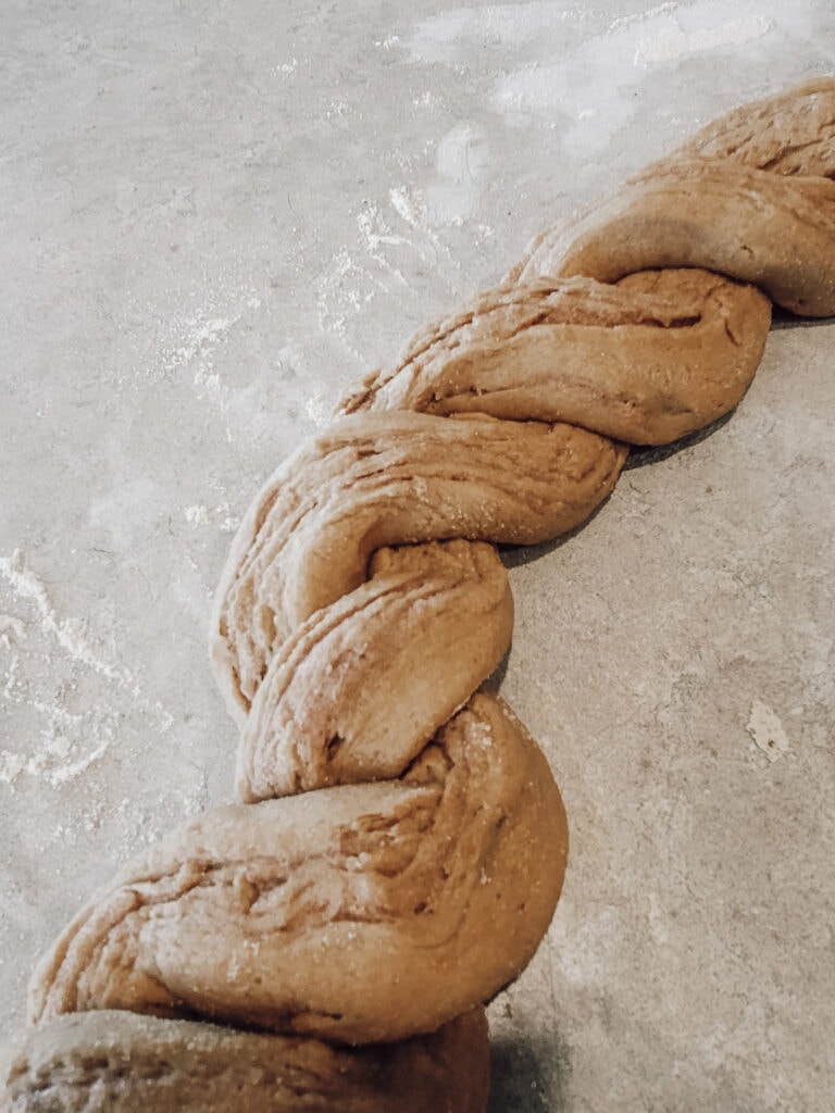 einkorn cinnamon rolls. Braid the two strands together by folding one over another.