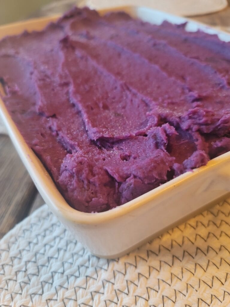 purple mashed potatoes in serving dish