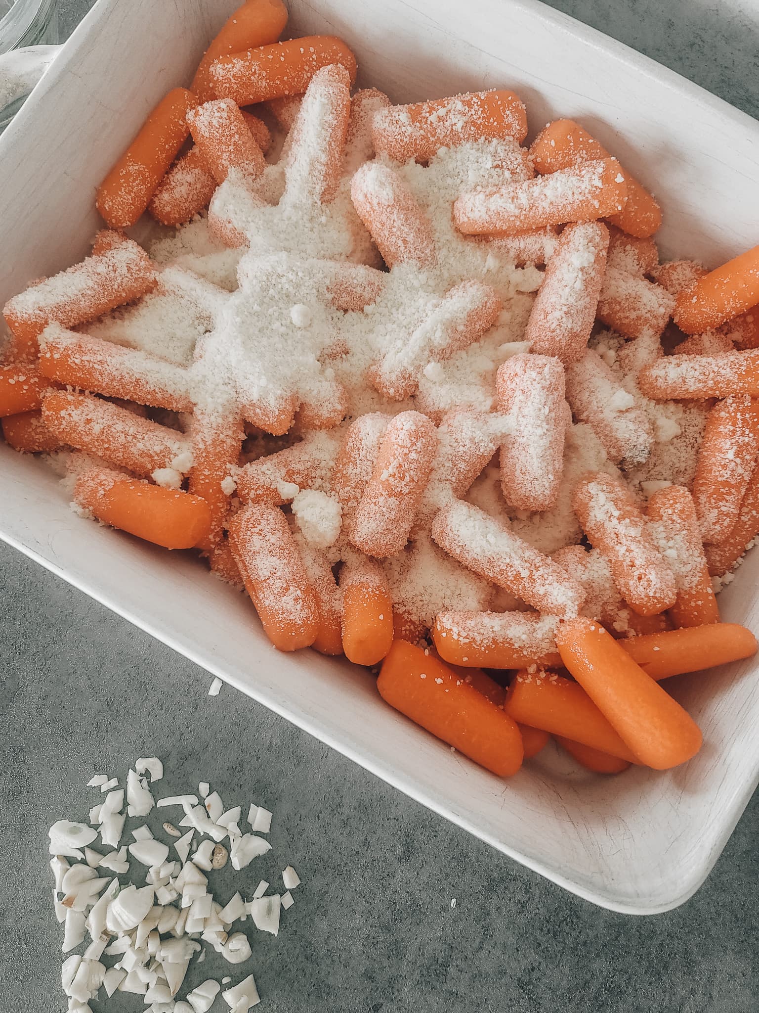 Cover equally with olive oil. Sprinkle parmesan over the top. Parmesan garlic roasted carrots