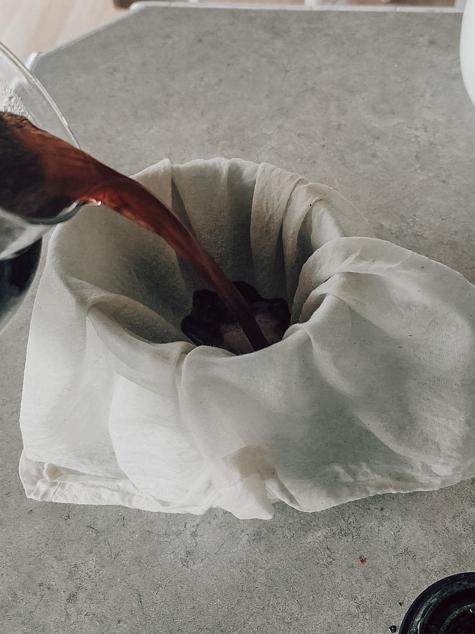 Easy Cold Brew Coffee. Strain the coffee through a cheesecloth or strainer. 