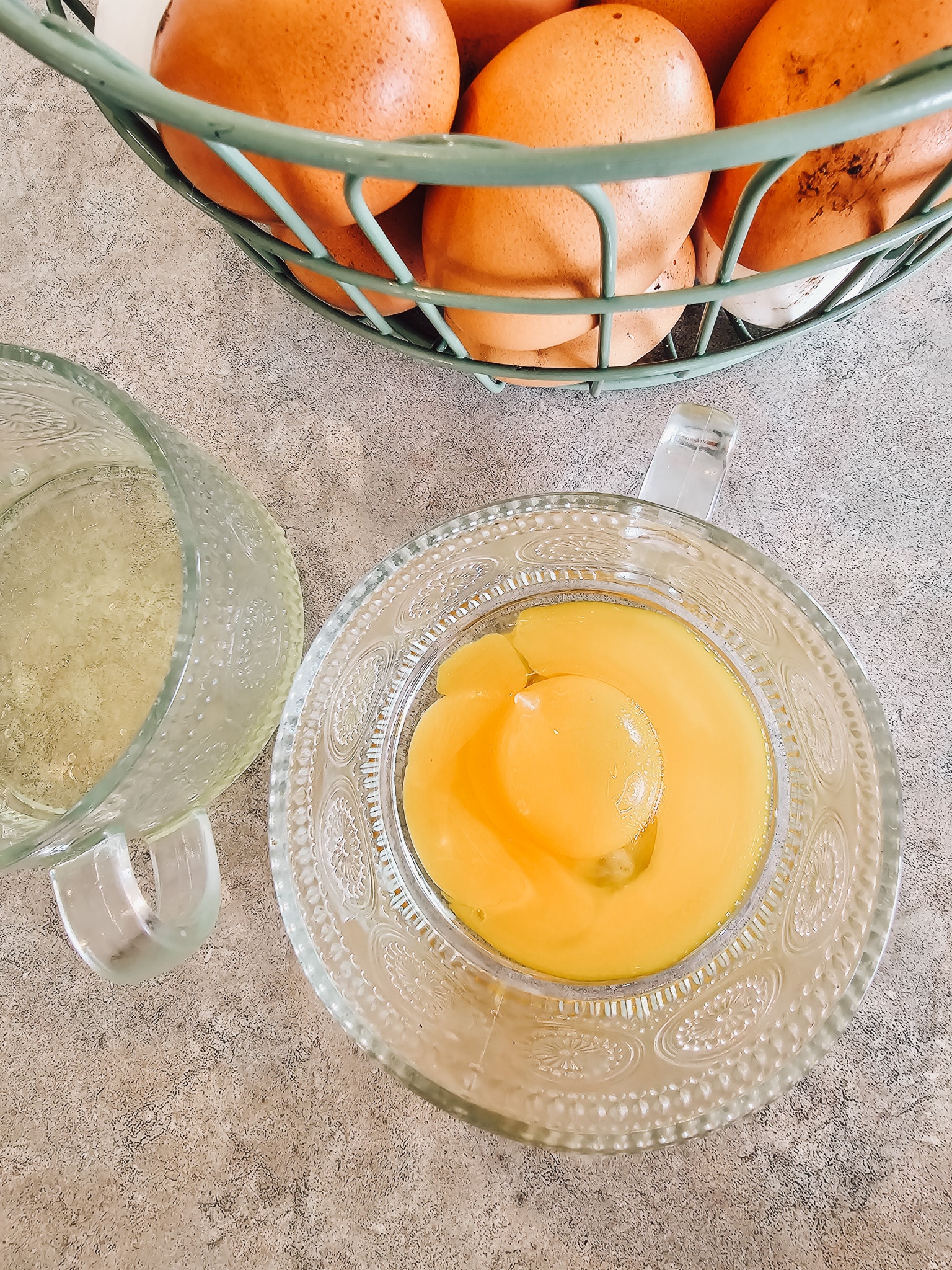 Two egg yolks in a mug 