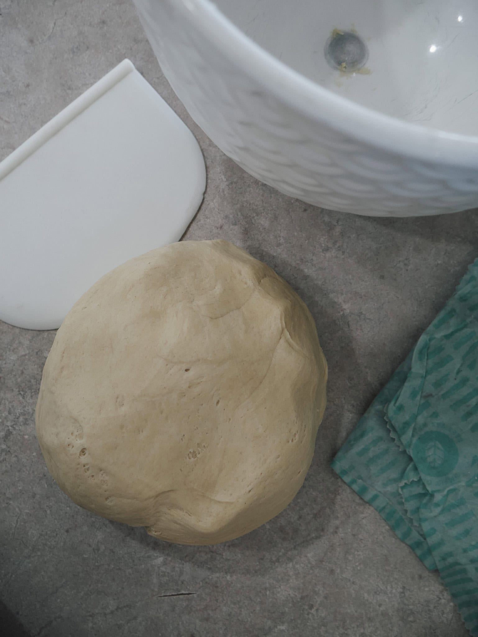 Easy Einkorn Bread Step 4: Grease a loaf pan lightly with oil, or line it with parchment paper. Transfer the dough onto a lightly floured surface. Gently shape it into a loaf.