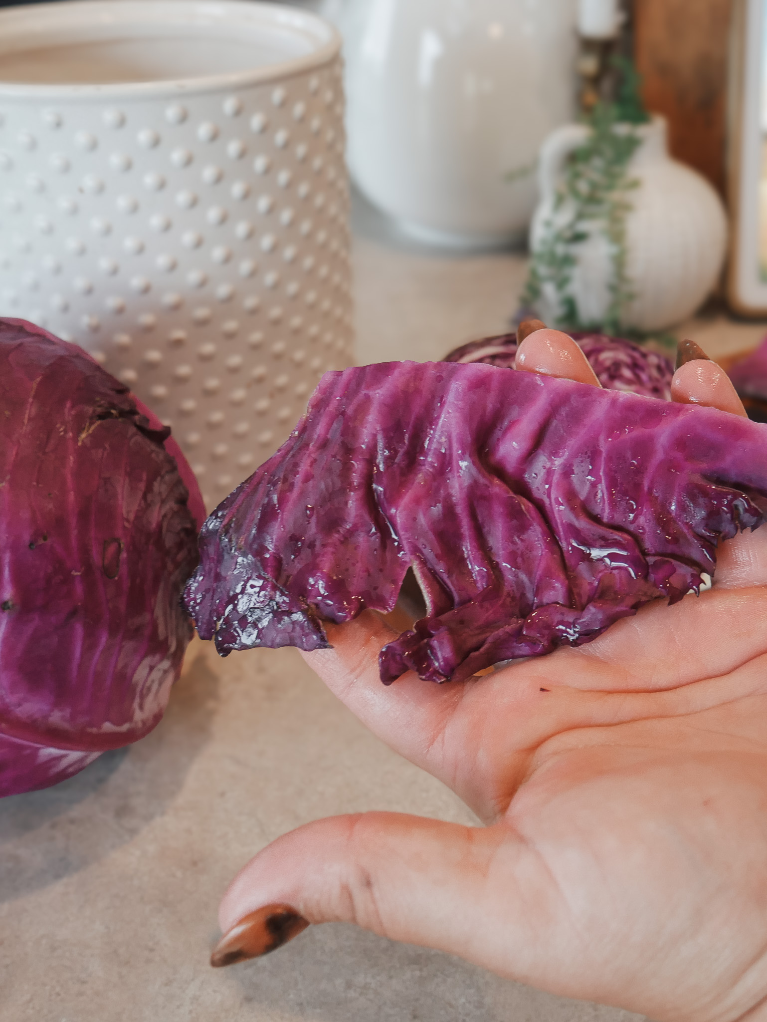 Classic Lacto-Fermented Sauerkraut - Remove a couple of the outer leaves from the cabbage and set them aside.