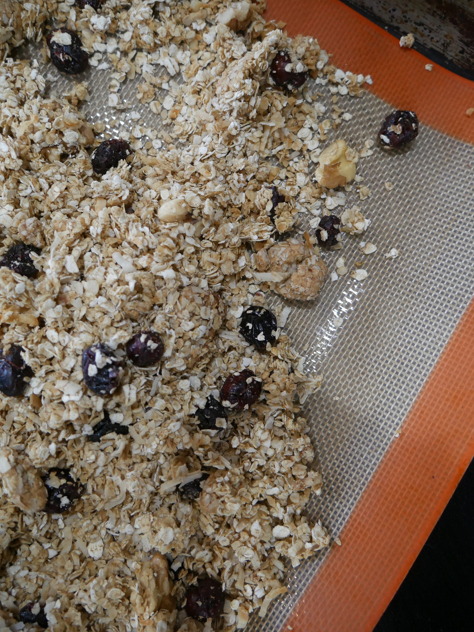 Bake for 25–30 minutes, gently stirring once about halfway through the baking time. Continue baking until the granola is lightly golden brown.- simple homemade granola recipe